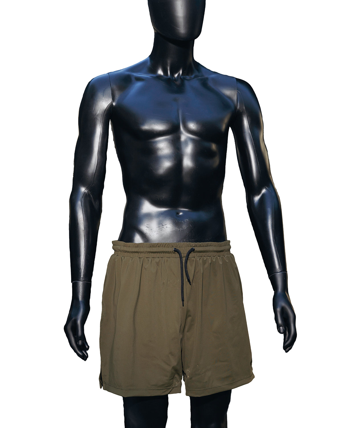 A mannequin wearing the Jobari Shorts from Ruin Rally, which feature military green and black outer shorts with a graphic pattern on the inner shorts.
